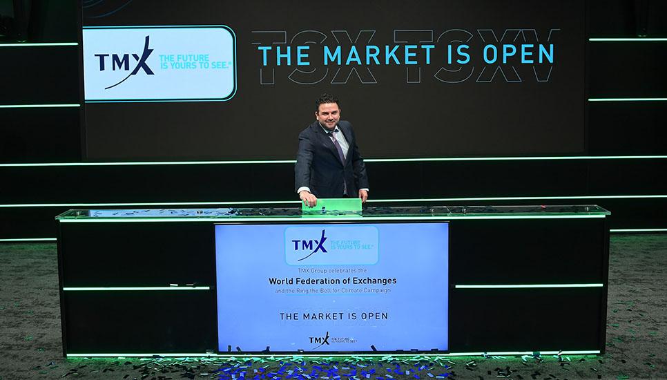Michael Ackerman ringing the bell for climate at the Toronto Stock Exchange on December 12, 2023.